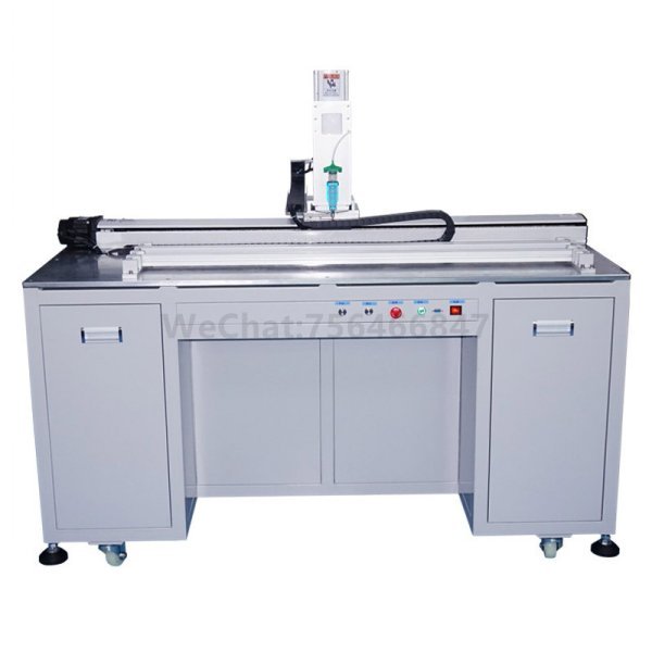 The dispenser is dispensing UV adhesive to the optical camera tube. Application instructions